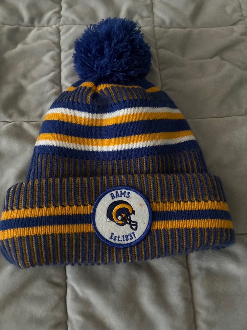 New Era Blue and Yellow Striped Pom Beanie
